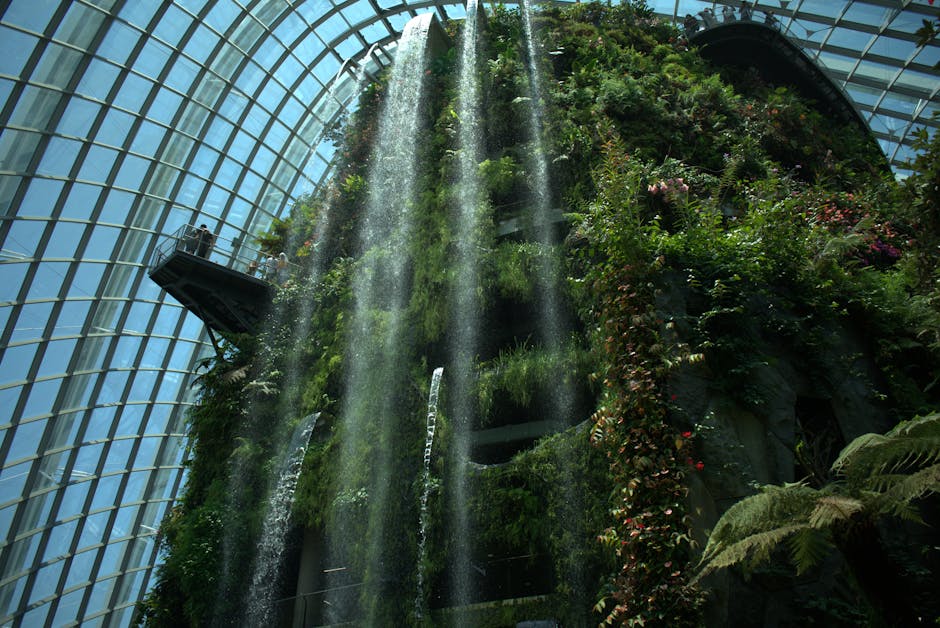 Explore the lush greenery and cascading waterfall at Singapore's iconic Cloud Forest domes.